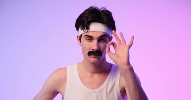 Poised Gentleman 80S Exudes Seriousness Displays Gesture Purple Backdrop Retro — Stock Video
