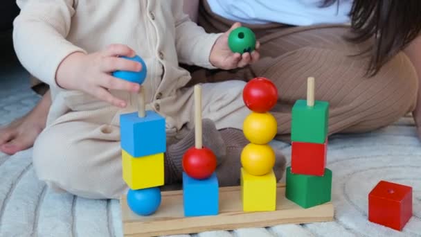 Close Active Curious Toddler Boy Playing Wooden Toys Colorful Bricks — Stock Video