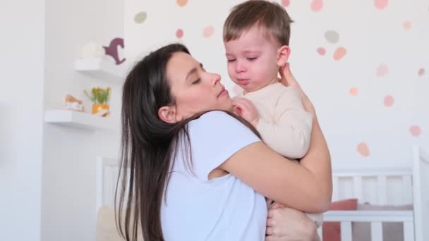 Compassionate Caucasian Mother Embracing Comforting Crying Little Sad Son Strokes — Stock Video