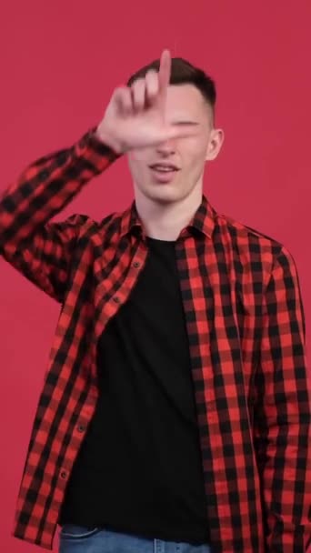 Positive Caucasian Young Man Playfully Showing Loser Gesture Forehead Red — Stock Video