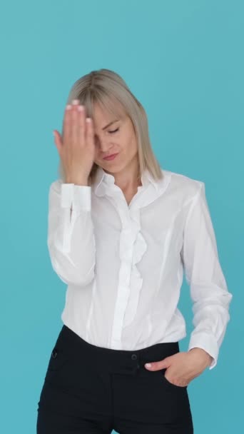 Unhappy Caucasian Businesswoman Showing Facepalm Gesture Blue Background Hopeless Embarrassment — Stockvideo