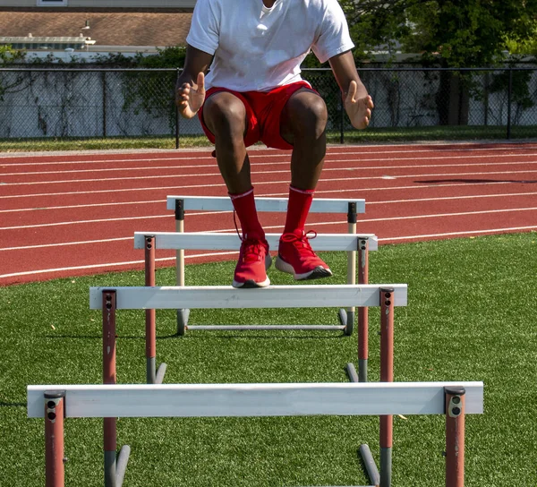 Front View High School Boy Jumping Track Hurdles Strength Flexibility — Stock Photo, Image