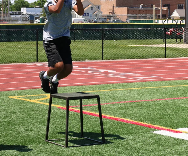High School Boy Air Jumping Plyos Box Green Turf Field — Stock Photo, Image