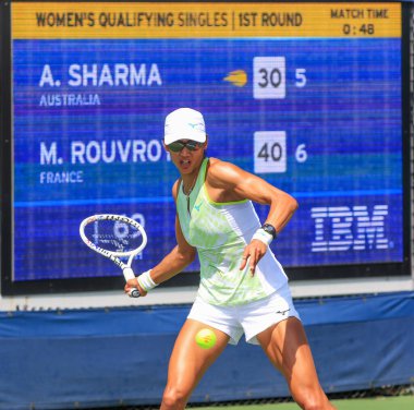 Queens, New York, USA - 20 August 2024: Astra Sharma a tennis player from Australia, strikes a forehand during her first round match which she won to move on. clipart