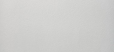 Beyaz desenli kumlu boya duvarı. Soyut alçı duvar arka planı