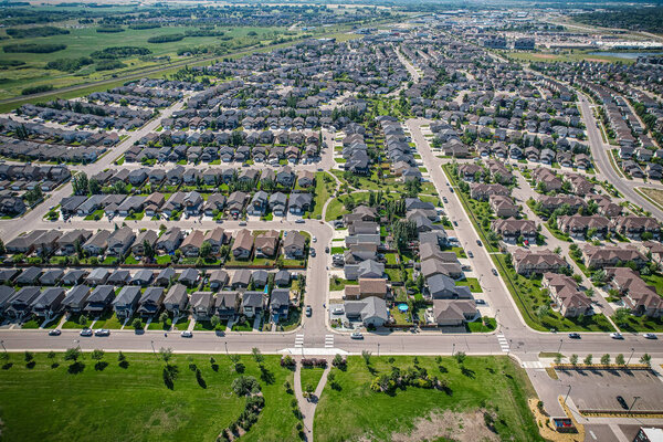 Captivating aerial shot of Stonebridge in Saskatoon, highlighting the harmonious blend of modern architecture and Saskatchewans verdant surroundings.