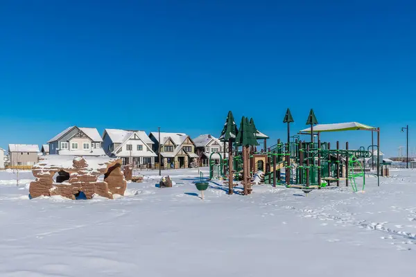 Experience the winter magic of Bear Paw Park in Saskatoon. This image captures the parks snowy landscape, frost-covered trees, and the serene beauty of a winters day in the city.