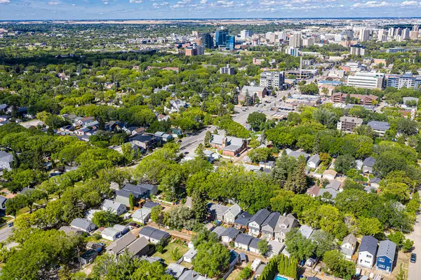 Explore the quaint Haultain neighborhood in Saskatoon from above. This drone image captures its charming streets, cozy homes, and the vibrant community spirit, all under the expansive prairie sky.