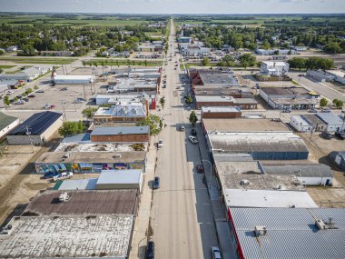 An aerial drone photo of Humboldt, Saskatchewan, showcasing residential neighborhoods, tree-lined streets, parks, and notable community buildings, surrounded by the scenic prairie landscape. clipart