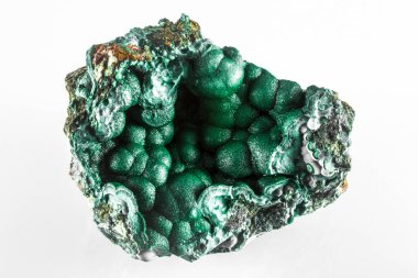 A large green Machite mineral rock with a hole in the middle. The rock is made of minerals and has a unique shape. It is a beautiful and interesting piece of nature clipart