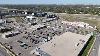 Stunning 4K drone video of Stonebridge, Saskatoons south neighborhood with shops, schools, and family homes.