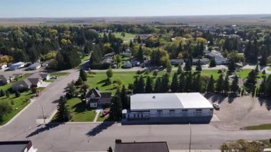Waldheim Saskatchewan from above in 4K, showing homes, streets, and surrounding farmland.
