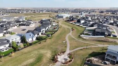 Aerial view of Rosewood in Saskatoon, highlighting modern homes, parks, and schools in this southeast community in crisp 4K.