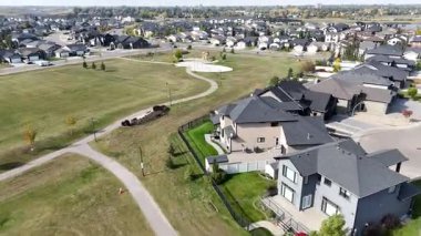 Stunning drone video of Rosewood Saskatoon showing residential streets, green spaces, and new developments in 4K.