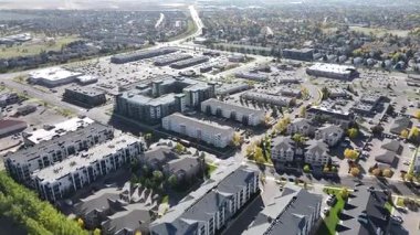 Aerial view of University Heights Suburban Centre in Saskatoon, showing condos, retail, and schools in crisp 4K.