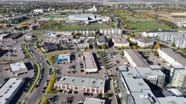 Drone video of University Heights Suburban Centre Saskatoon with residential streets, shops, and parks captured in 4K.
