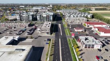 Drone video of University Heights Suburban Centre Saskatoon with residential streets, shops, and parks captured in 4K.