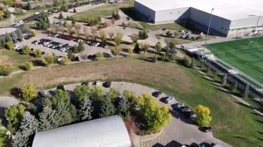 Aerial view of University Heights Saskatoon highlighting schools, recreation areas, and community spaces in 4K.