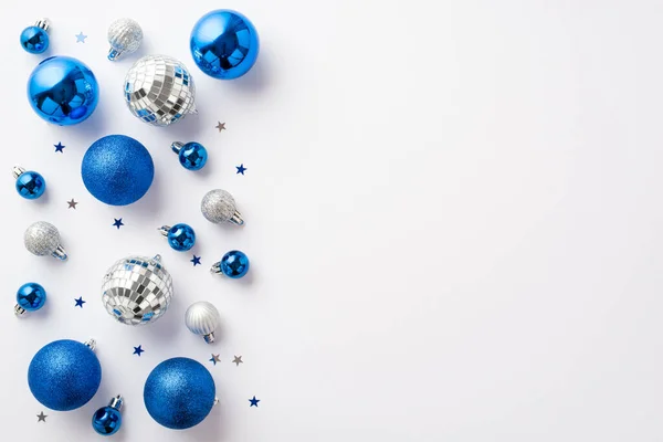 stock image Christmas decorations concept. Top view photo of blue white silver baubles glowing disco balls and confetti on isolated white background with empty space