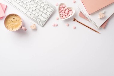 8-march concept. Top view photo of workspace keyboard pink reminders golden pen heart shaped plate with sprinkle clips and cup of frothy coffee on isolated white background with copyspace