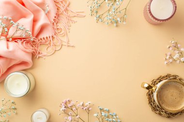 Hello spring concept. Top view photo of candles pink plaid cup of coffee on wicker serving mat and gypsophila flowers on isolated pastel beige background with copyspace in the middle