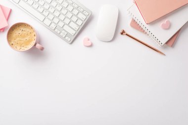 Valentine's Day concept. Top view photo of workplace keyboard computer mouse pink copybooks golden pen hearts and cup of frothy coffee on isolated white background with copyspace