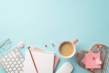 Valentine's Day concept. Top view photo of keyboard notebooks pen heart shaped stationery holder pushpins sticky note paper glasses and cup of coffee on isolated pastel blue background with copyspace