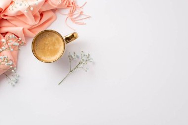 Hello spring concept. Top view photo of cup of hot frothy drinking pink scarf and gypsophila flowers on isolated white background with empty space