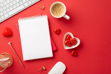 Top view photo of notepads golden pen heart shaped saucer with candies mug of coffee keyboard computer mouse binder clips pencils holder and candles on isolated red background with empty space