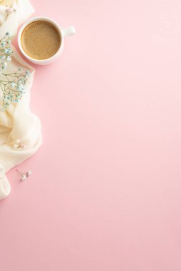 Hello spring concept. Top view vertical photo of cup of frothy cocoa blue gypsophila flowers and white soft scarf on isolated light pink background with copyspace