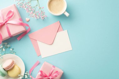 St Valentine's Day concept. Top view photo of pink envelope with letter gift boxes plate with macarons cup of coffee heart and gypsophila flowers on isolated pastel blue background with copyspace