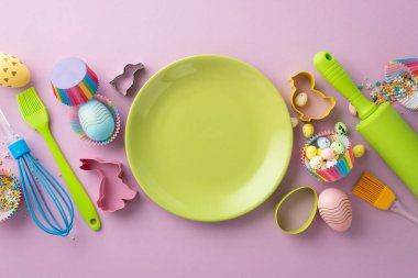 Easter concept. Top view photo of green empty dish kitchen utensils colorful easter eggs and paper baking molds with sprinkles on isolated pastel violet background with empty space
