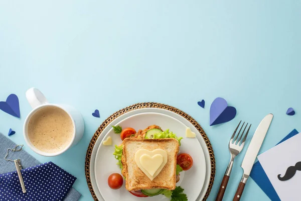 stock image Delight Dad with a homemade breakfast. Top view of veggie sandwich, cutlery, coffee, napkin, tie, postcard, men's accessories, on pastel blue background with space for text