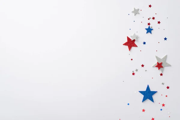 stock image American Independence Day concept featuring top-view composition of festive party decorations: glitter stars and sparkle confetti against a white backdrop with empty space for text or advertising