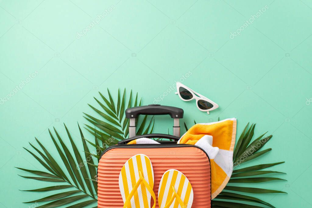 Let your imagination take flight against a turquoise backdrop, showcasing top view of a suitcase with towel, beach gear, sunglasses, flip-flops and palm leaves. Ideal for travel branding