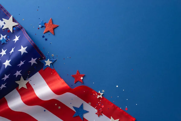 stock image National Labour Day concept. Top view photo of american flag with white, red and blue star-shaped sparkles on blue isolated background with copy-space