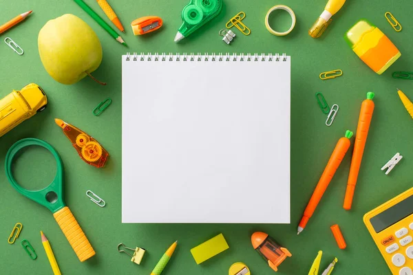 stock image Unleash your creativity and learn. Discover top view array of amusing stationery like carrot-shaped pens, pencils, album, cute bus toy and more, all on green board backdrop with space for ad placement