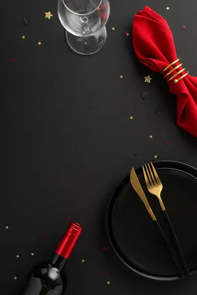 Unforgettable Black Friday dining deal: vertical top view sophisticated table setup, including dishes, red napkin, wine bottle, glass, dazzling confetti on black surface. Great for promotional needs