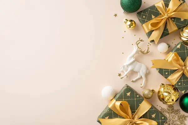 New Year\'s grandeur and motivation on display. Top view shot showcases presents adorned with ribbon, luxurious baubles, reindeer embellishment, luminous sequins on light beige backdrop, space for ads