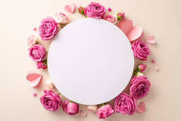Observing March 8th, this top view image beautifully displays petite paper hearts and fresh rose petals spread over empty circular card on pastel beige surface, reserving space for text or an advert