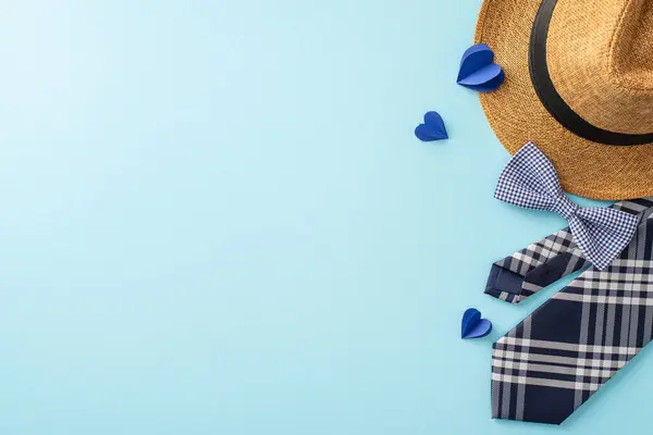 stock image Perfect for Father's Day, this image features a stylish straw hat, a checkered tie, and blue hearts on a soft blue background
