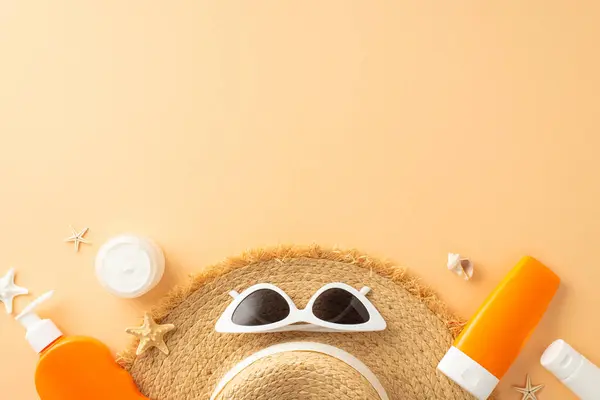 Protect your skin with flair: top view of SPF bottles, straw hat, sunglasses, seashells, and starfishes on a soft orange backdrop. Promote your message with ease