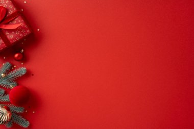 Vibrant red backdrop with wrapped gifts, pine branches, and gold ornaments sets a warm holiday mood for Christmas and New Year greetings