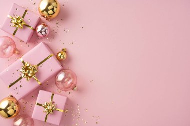Colorful scene showing pink gift boxes with gold ribbons, ornaments, and confetti on a soft pink backdrop, perfect for holiday promotions, greeting cards, and seasonal marketing