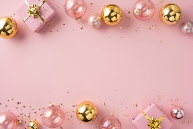 A festive pink backdrop with gold ornaments, gift boxes, and ribbons evokes holiday cheer for Christmas and New Year greetings. Perfect for seasonal promotions, celebrations, and party decor ideas