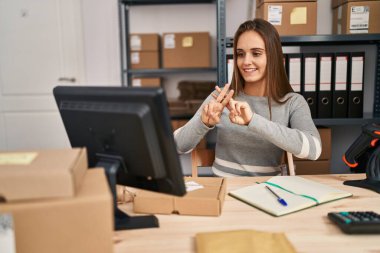 Young blonde woman ecommerce business worker having online deaf language conversation at office