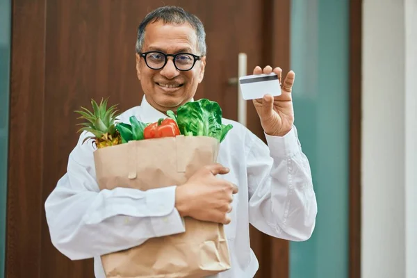 Middle Age Southeast Asian Man Smiling Holding Bag Fresh Groceries —  Fotos de Stock
