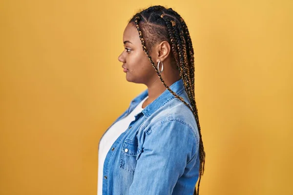 African American Woman Braids Standing Yellow Background Looking Side Relax — Photo