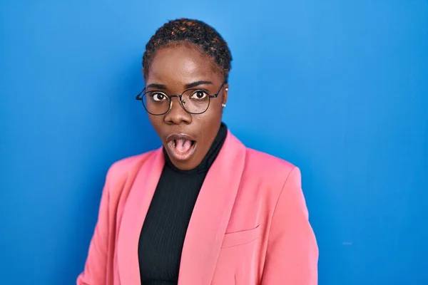 Beautiful Black Woman Standing Blue Background Afraid Shocked Surprise Expression — Stockfoto