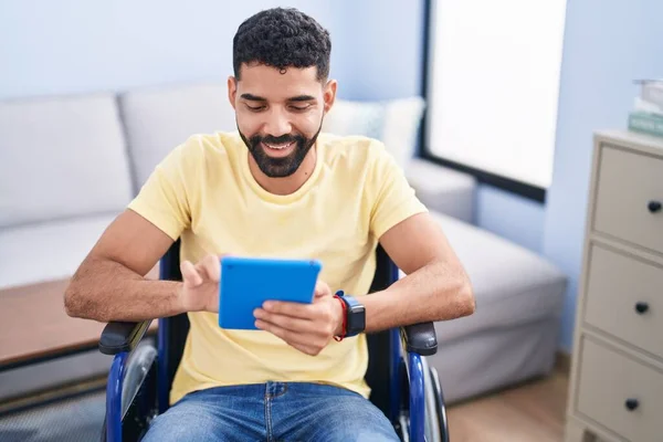 Young Arab Man Using Touchpad Sitting Wheelchair Home — ストック写真